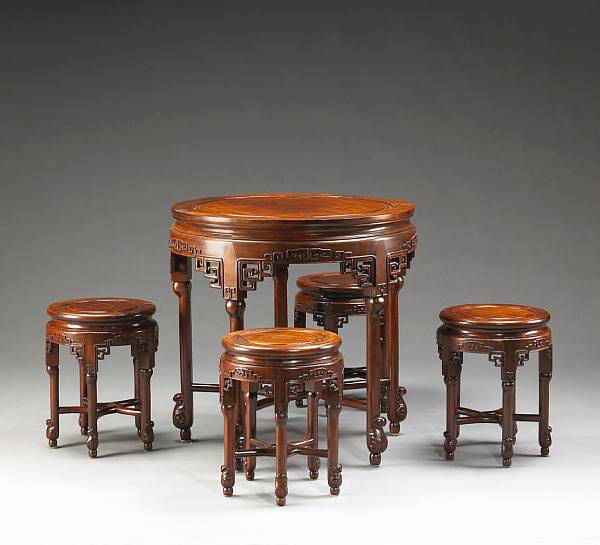 Appraisal: A set of four rosewood circular stools and a circular