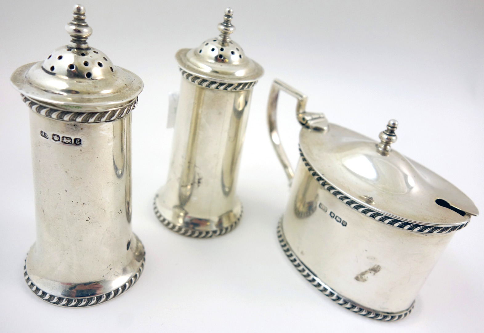 Appraisal: A George V three piece silver cruet set makers mark