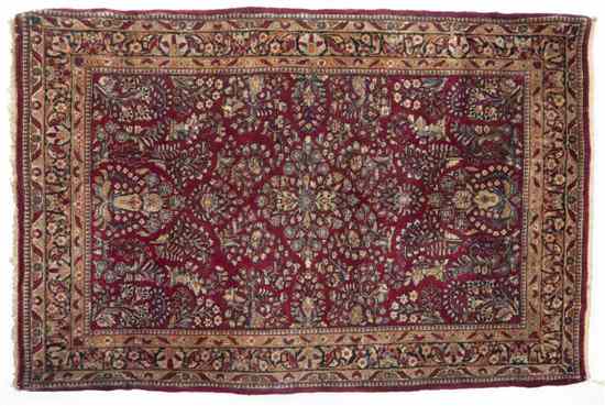 Appraisal: A Sarouk Wool Rug having stylized foliate center medallion on