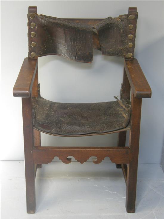 Appraisal: A th century Spanish open armchair with leather back and