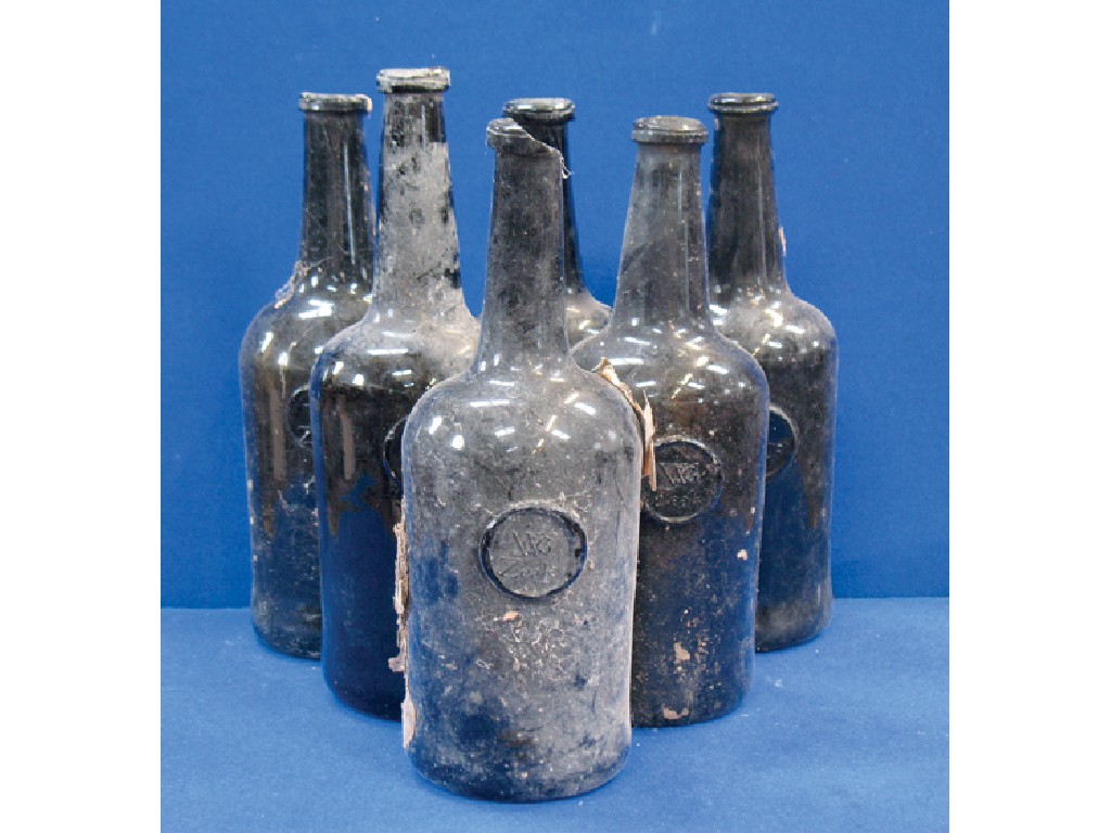 Appraisal: A COLLECTION OF SIX EARLY GREEN GLASS WINE BOTTLES including