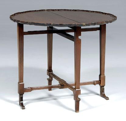 Appraisal: British patent tea table fold over mahogany piecrust top on