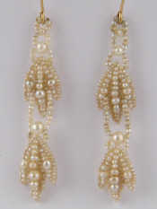 Appraisal: A pair of seed pearl drop earrings with yellow metal