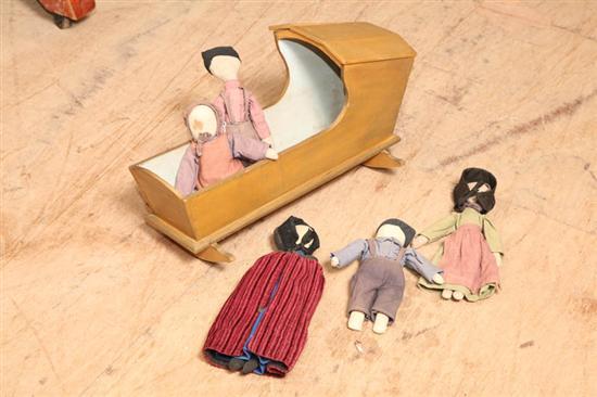 Appraisal: FIVE AMISH DOLLS AND A CRADLE A boy with purple