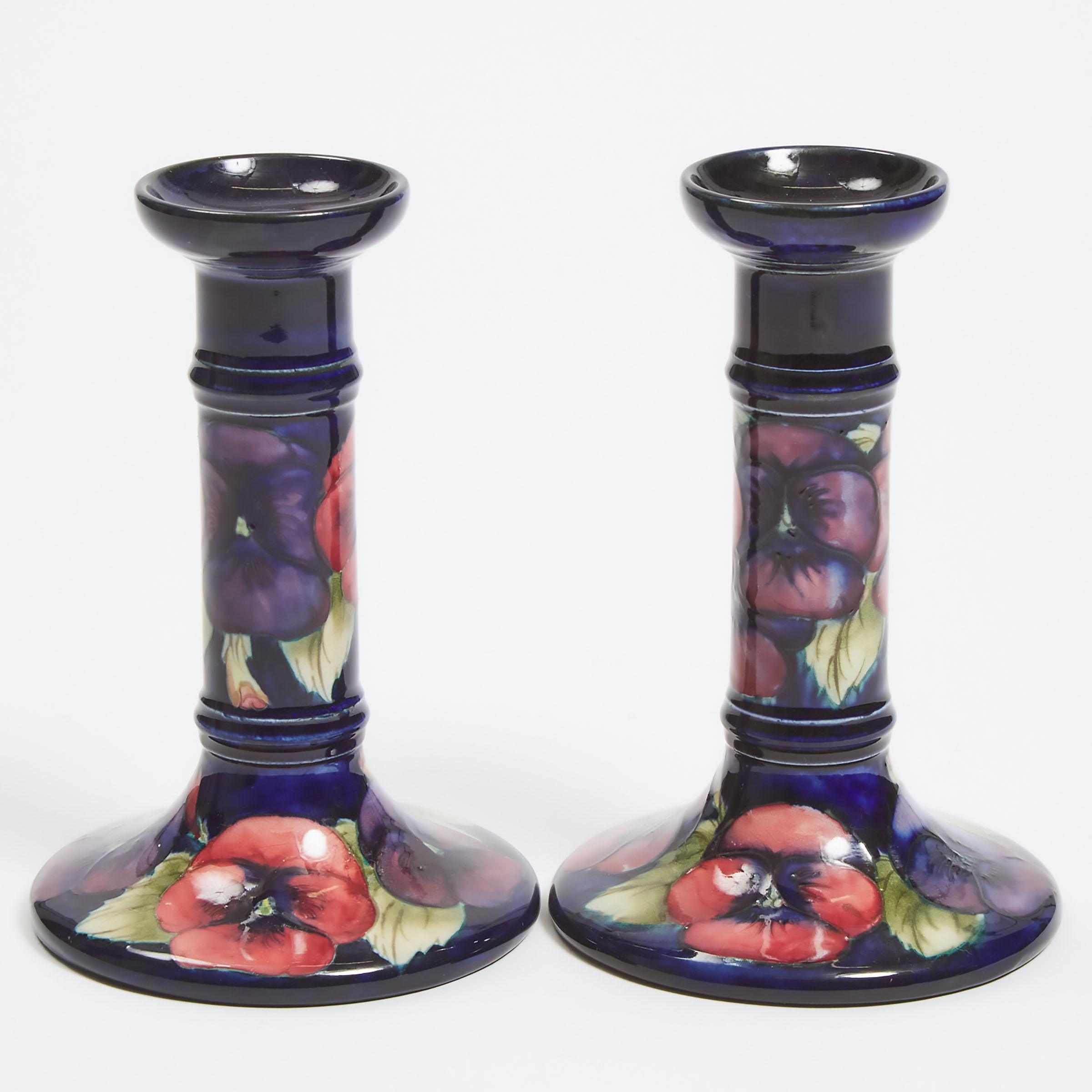 Appraisal: Pair of Moorcroft Pansy Table Candlesticks c height in cm