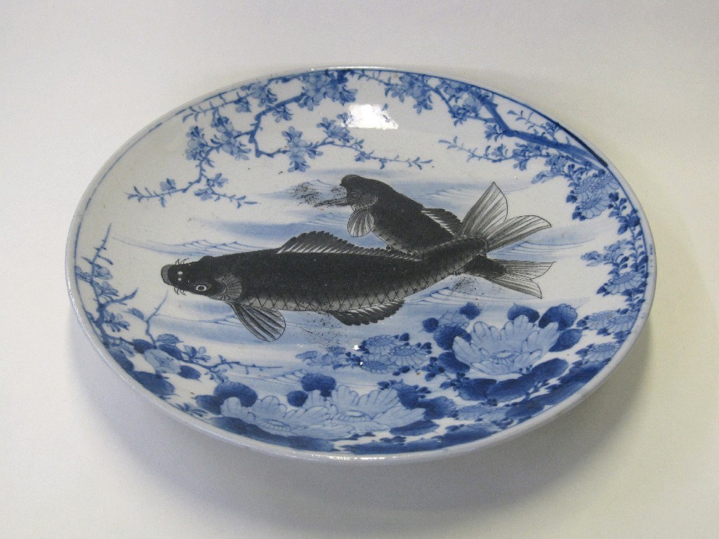 Appraisal: Oriental blue and white plate decorated with two black koi