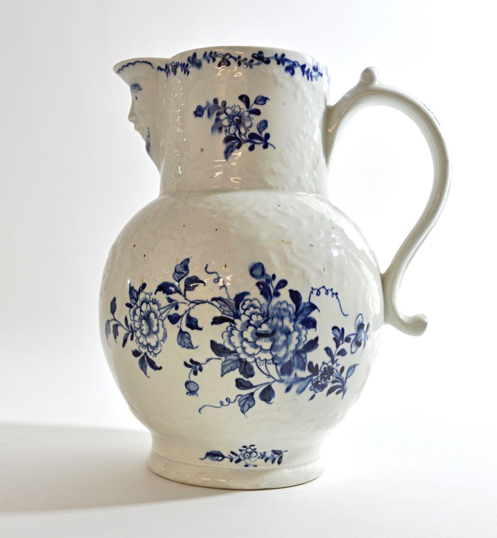 Appraisal: A Lowestoft blue and white mask jug circa relief decorated