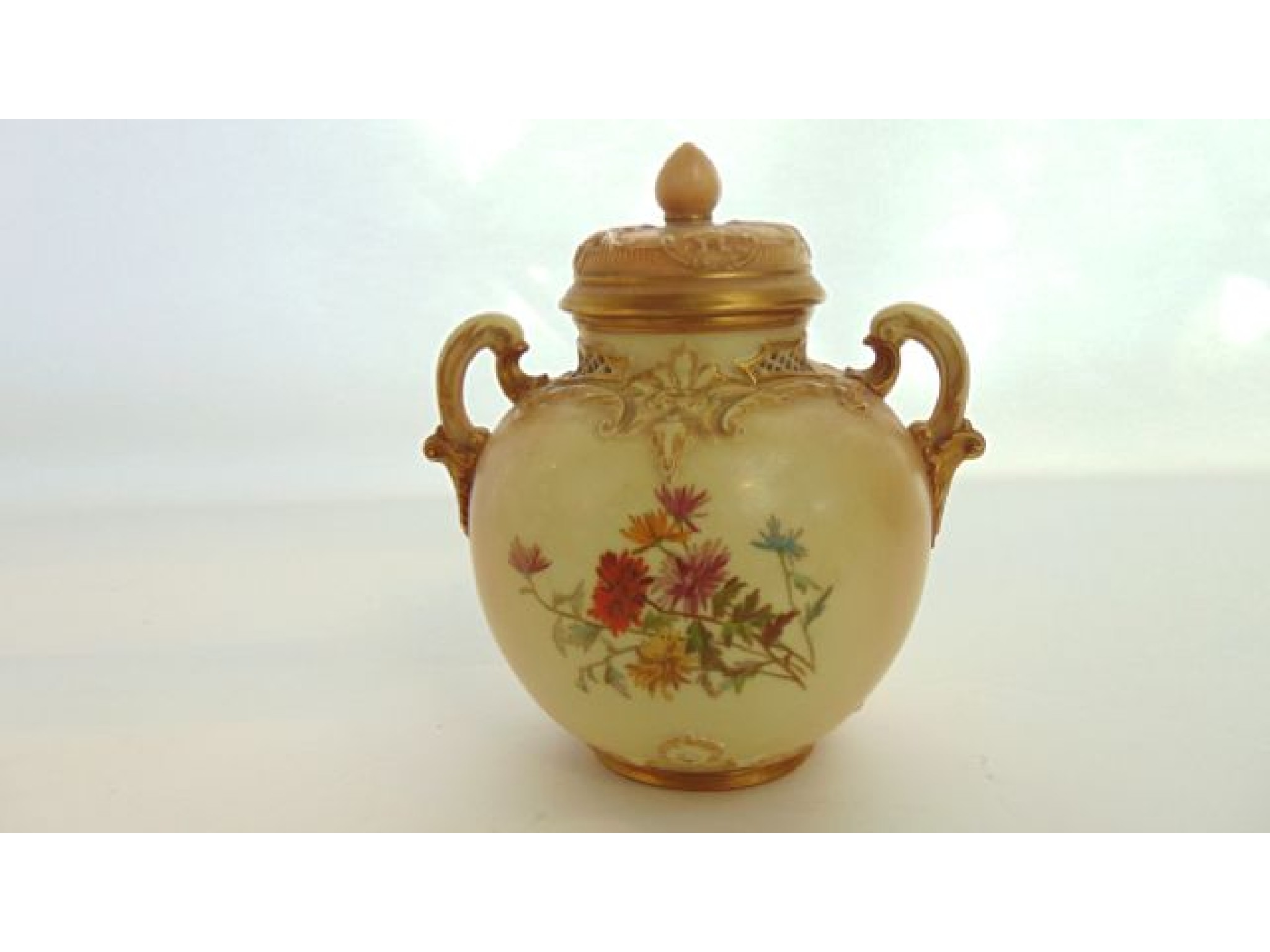 Appraisal: A Royal Worcester blush ivory two handled vase and cover