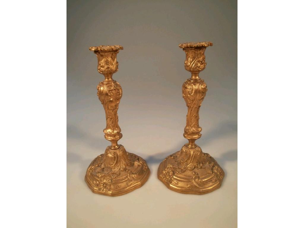 Appraisal: A pair of thC cast gilt rococo candlesticks cm high