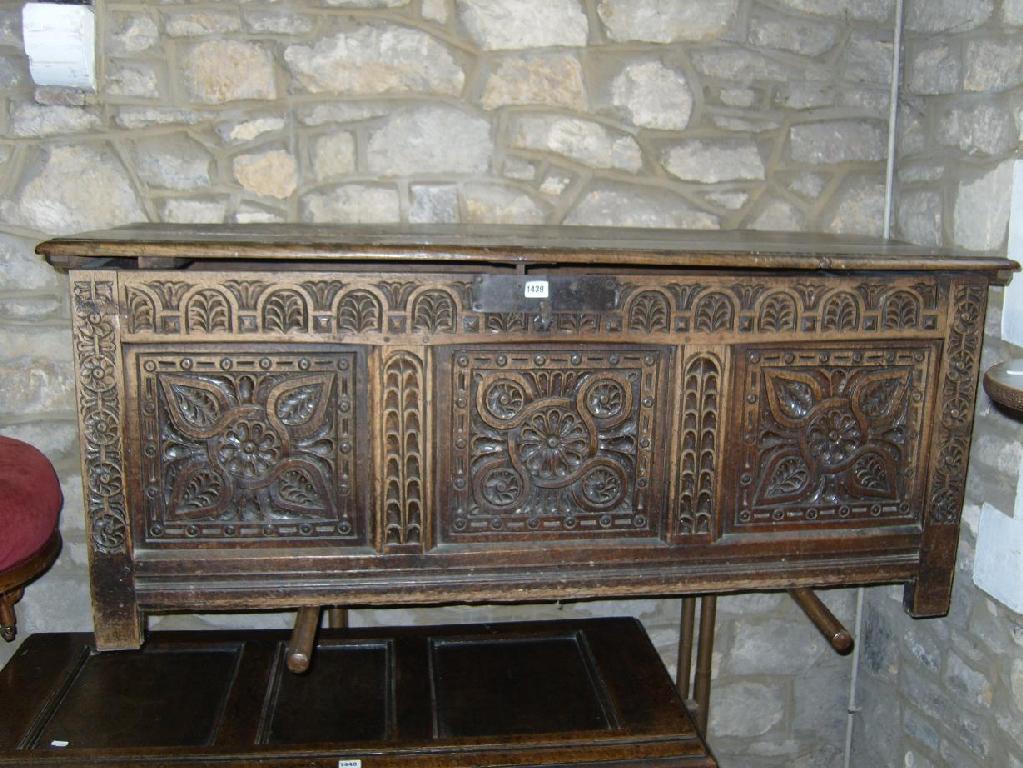 Appraisal: A th century oak coffer with planked top the front