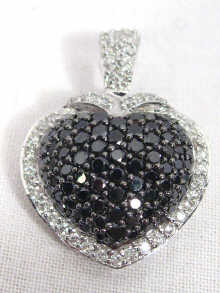 Appraisal: An carat white gold black and white diamond heart shaped