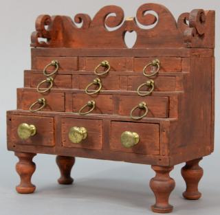 Appraisal: Miniature Federal chest having open work carved gallery over twelve