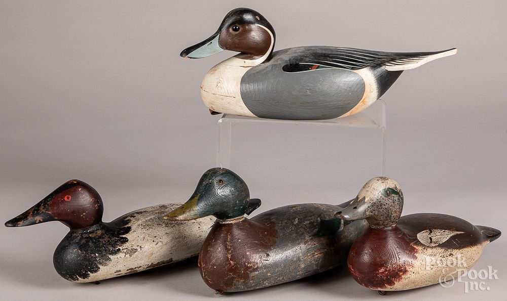 Appraisal: Four carved and painted duck decoys Four carved and painted