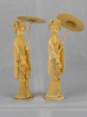 Appraisal: Two Japanese ivory figures each a lady with parasol circa