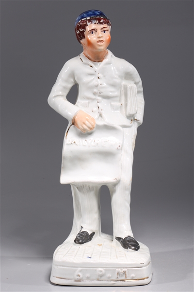 Appraisal: Antique English Staffordshire porcelain paper boy with gilt detail late