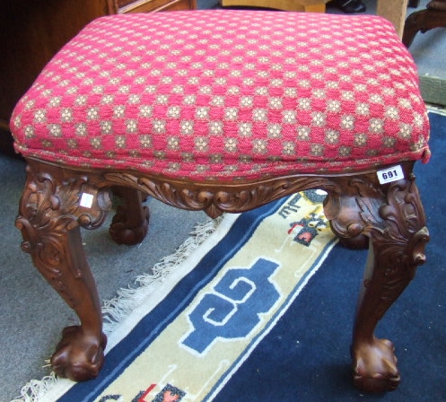 Appraisal: An th style foot stool the serpentine shaped over stuffed