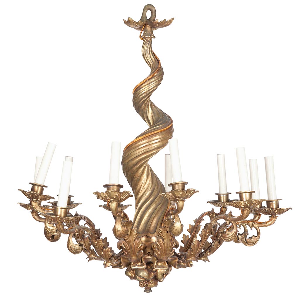 Appraisal: Rococo Style Gilt-Bronze Twelve-Light Chandelier The flaring spiral cast standard