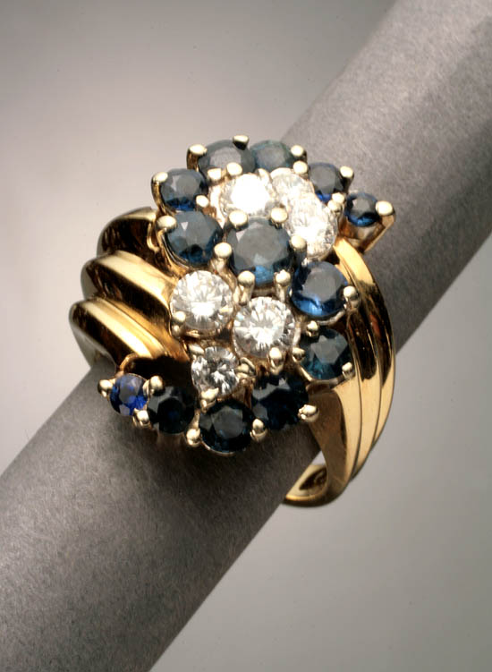 Appraisal: -Karat Yellow-Gold Blue Sapphire and Diamond Dinner Ring The four-prong