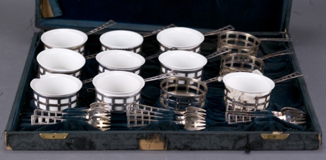 Appraisal: Twelve pierced ramekin holders with nine white ramekins and eleven