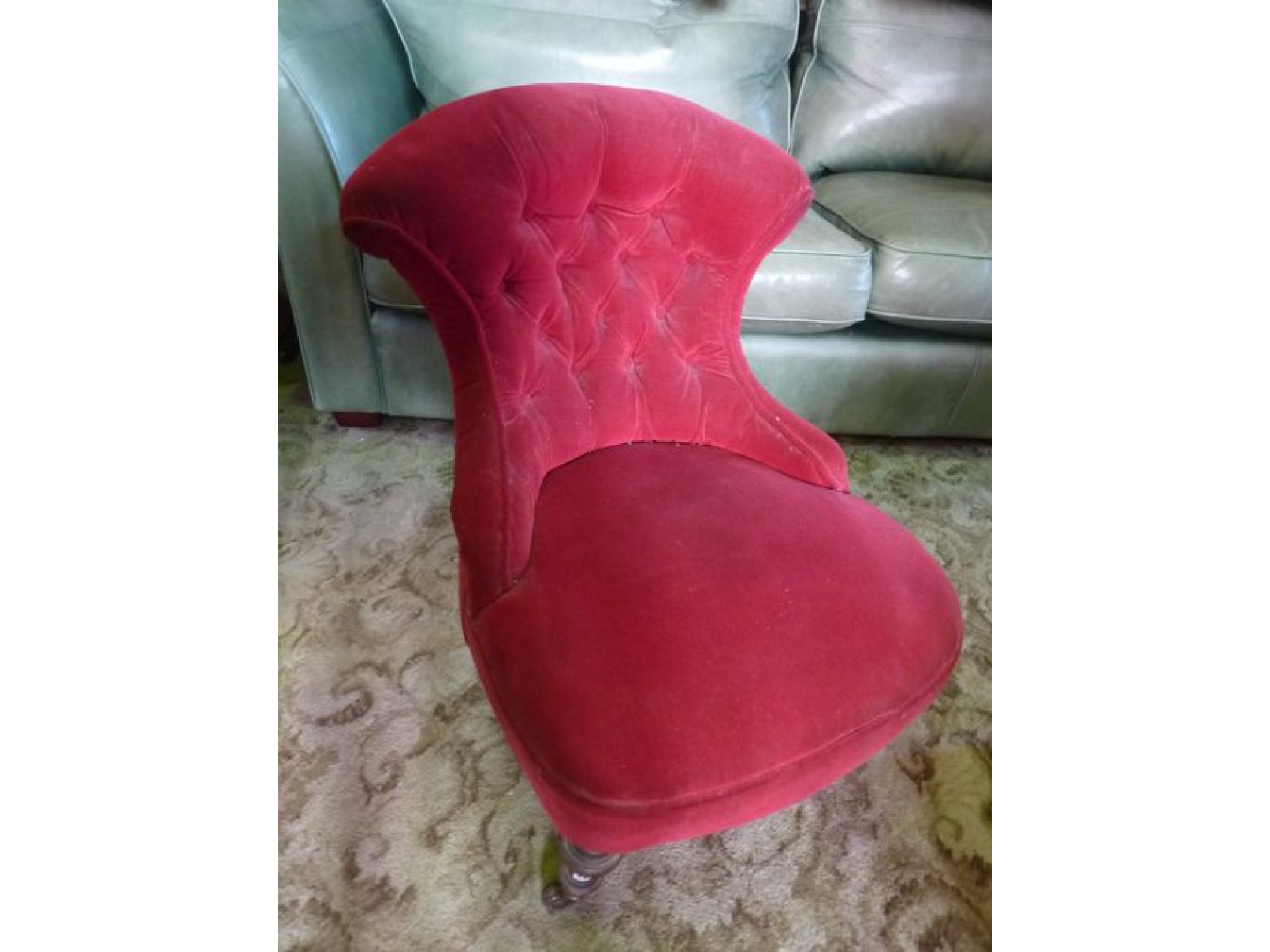 Appraisal: A Victorian occasional nursing chair with upholstered finish waisted buttoned