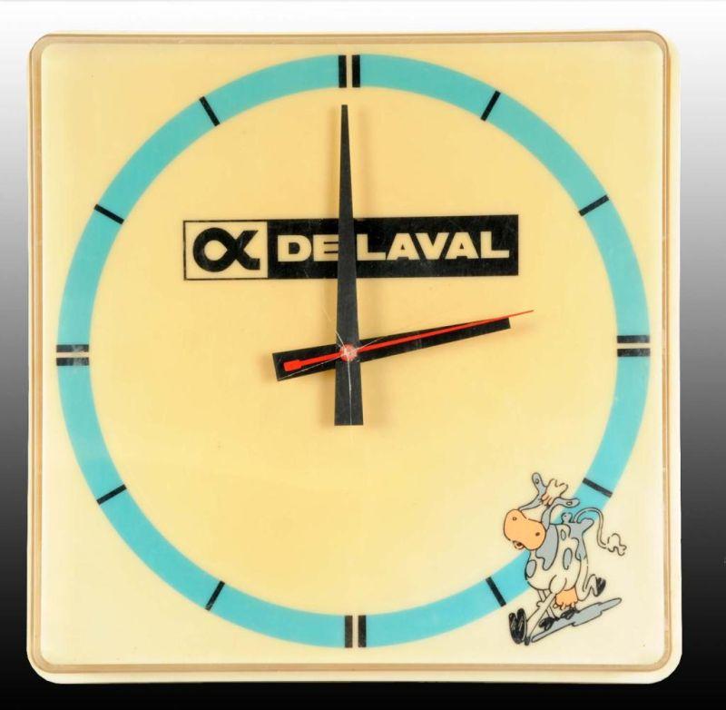 Appraisal: Plastic De Laval Light-Up Electric Clock Description s to s