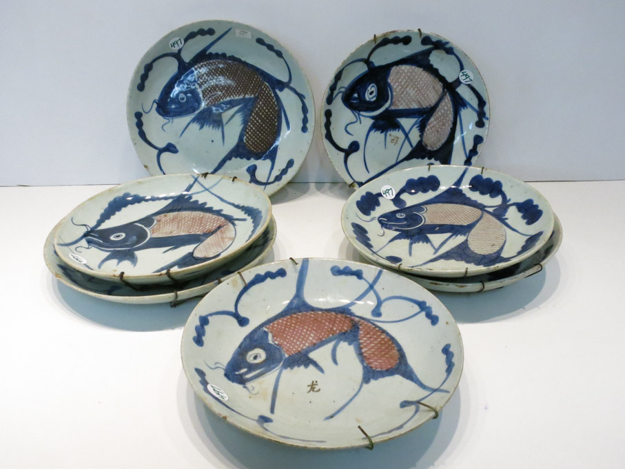 Appraisal: SEVEN CHINESE PORCELAIN FISH PLATES each depicting a red and