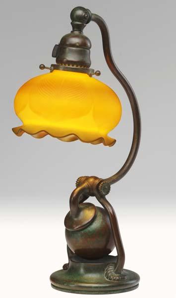 Appraisal: TIFFANY STUDIOS Bronze counter-balance desk lamp the ruffled gold Favrile