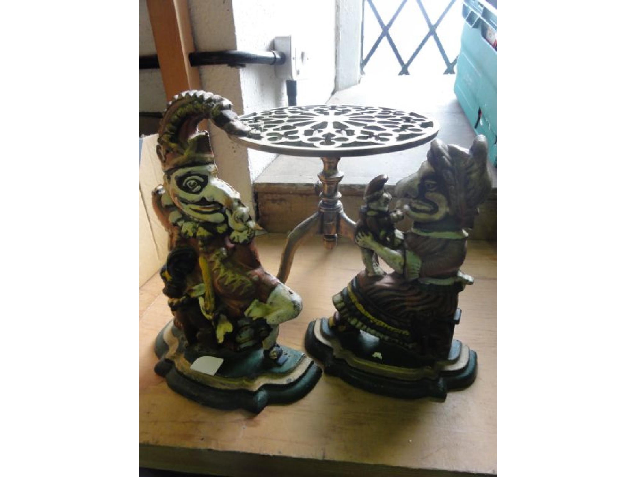 Appraisal: A pair of painted cast iron doorstops in the form