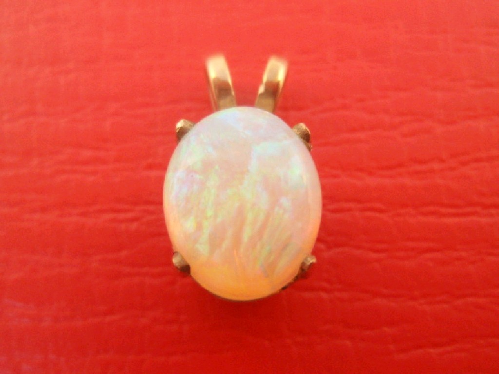 Appraisal: A cabochon opal pendant mm x mm