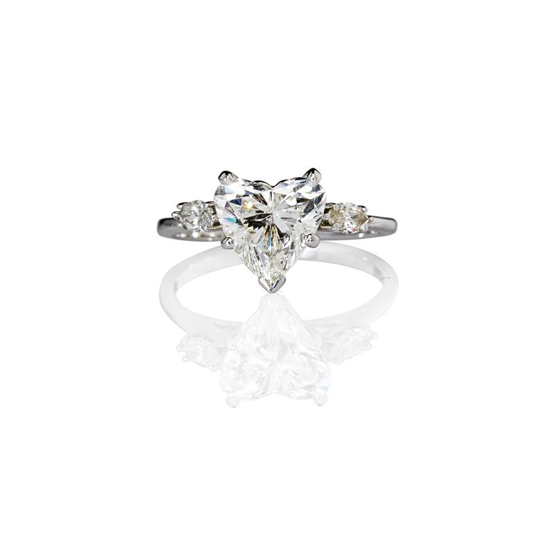 Appraisal: HEART SHAPED DIAMOND ENGAGEMENT RING Approx cts flanked by marquise