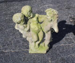 Appraisal: Cast stone garden statue cherubs Cast stone garden statue cherubs