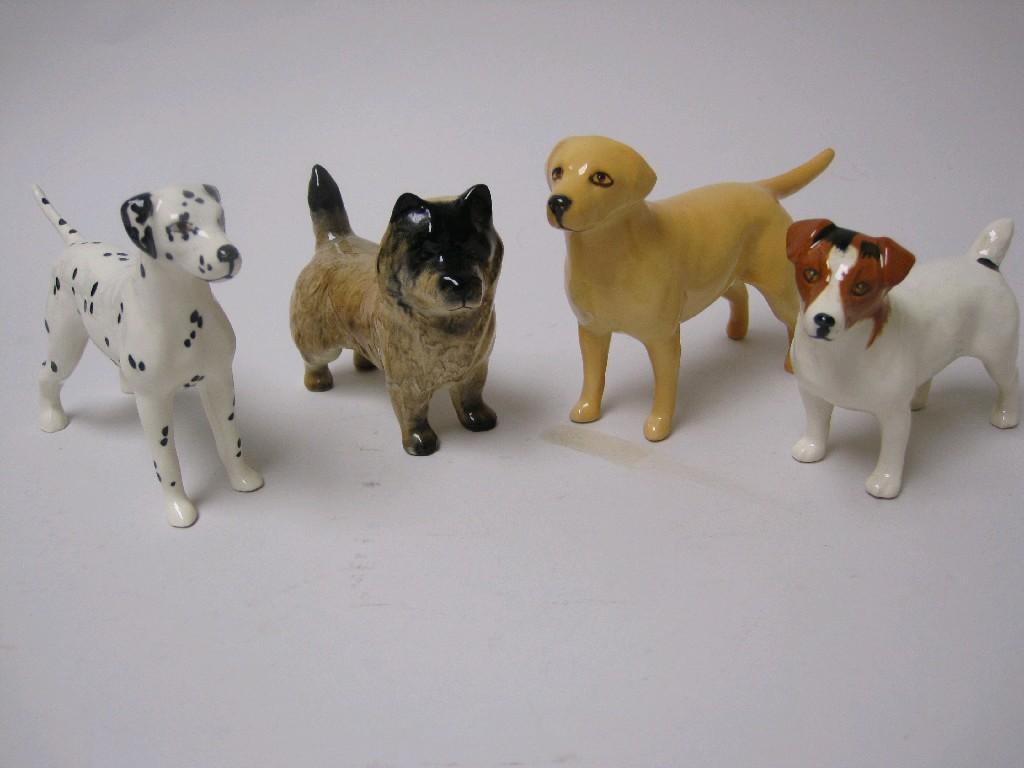 Appraisal: Four Beswick Dogs including Labrador pup Dalmation Terrier etc