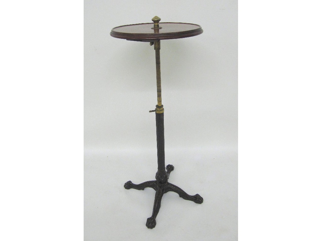 Appraisal: A Victorian mahogany adjustable occasional table the circular top with