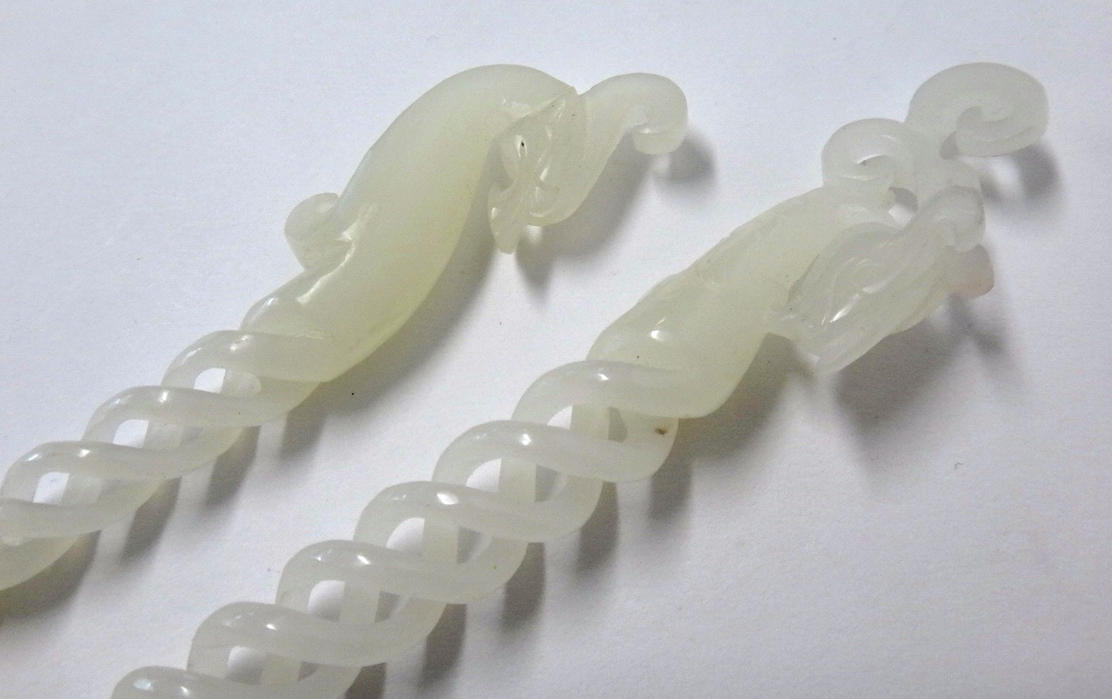 Appraisal: Two Chinese white jade hairpins modern each with spiral twists