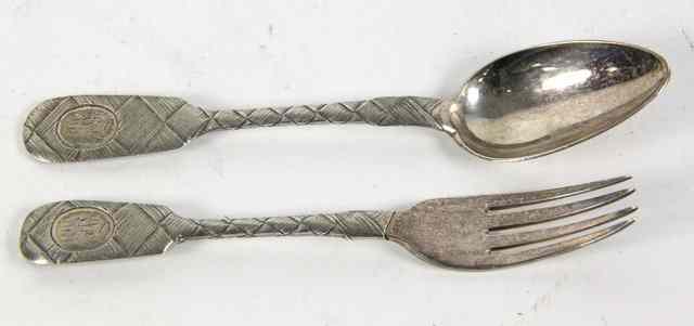 Appraisal: A Russian silver spoon and fork the stems and terminals