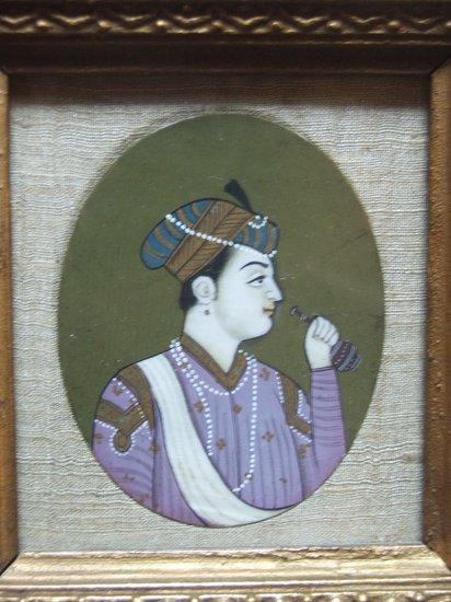 Appraisal: AN INDIAN PORTRAIT MINIATURE on ivory depicting a young man