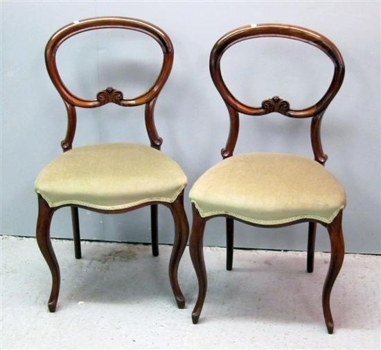 Appraisal: Pair of Victorian rosewood balloon back dining chairs with padded