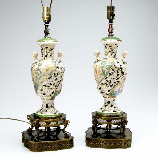 Appraisal: PAIR OF CERAMIC LAMPS With openwork bodies having figures in