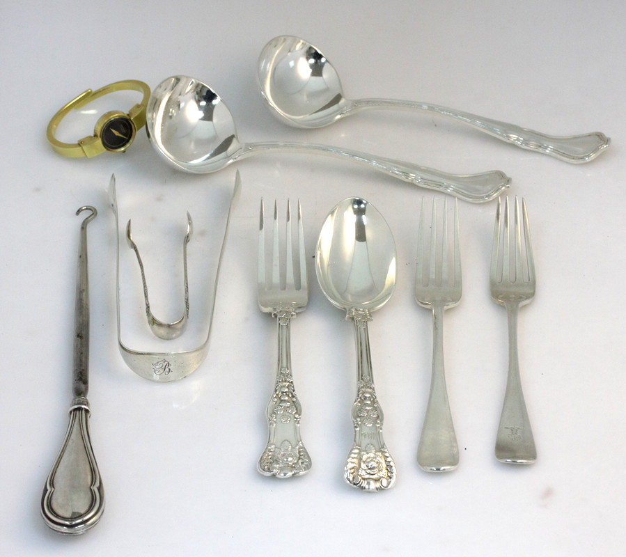 Appraisal: A decorative silver spoon and fork London the shaped terminals