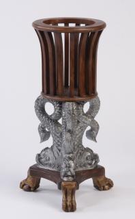 Appraisal: Carved mahogany dolphin plant stand Carved mahogany plant stand the