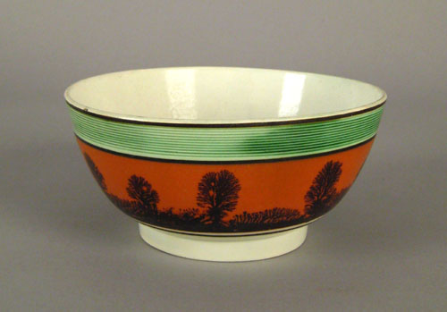 Appraisal: Mocha bowl th c with seaweed decoration on an orange