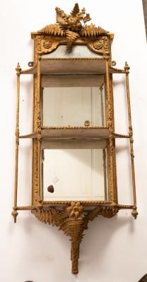 Appraisal: Two giltwood and plaster mirror back shelves with fern surmount