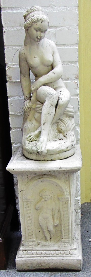 Appraisal: A pair of reconstructed stone figures of seated naked ladies