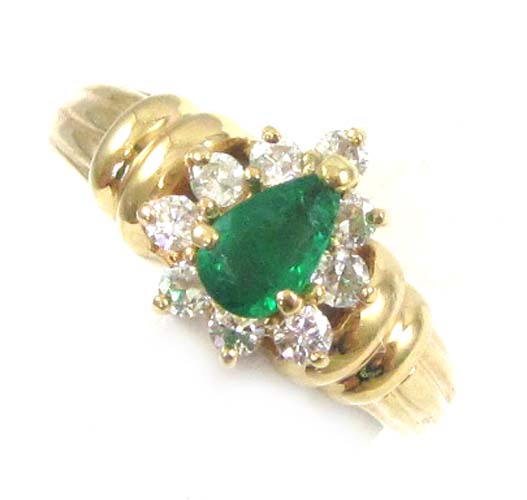 Appraisal: EMERALD DIAMOND AND FOURTEEN KARAT GOLD RING with nine round-cut