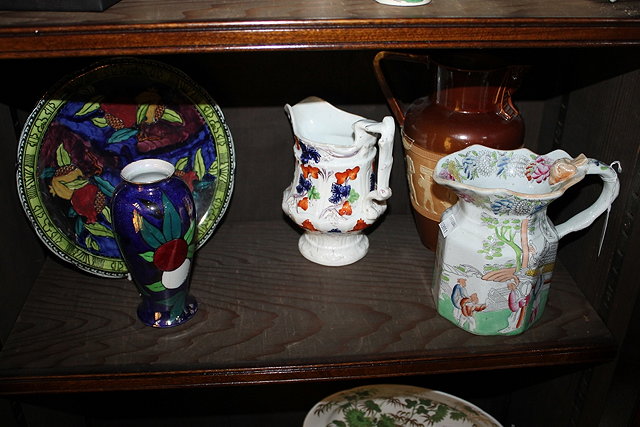 Appraisal: A RUBENS WARE POMEGRANATE PLATE and a Carltonware small vase