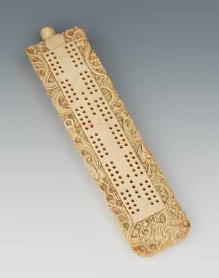 Appraisal: A Chinese Ivory Carved Cribbage Board Ornately carved on the