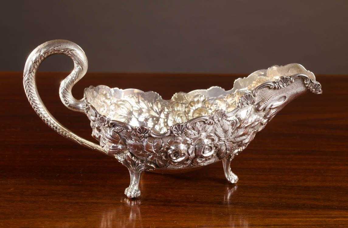 Appraisal: STIEFF REPOUSSE STERLING SILVER FOOTED GRAVY BOAT Stieff Rose pattern