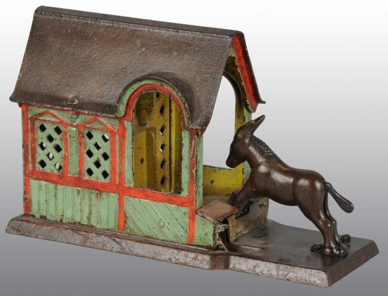 Appraisal: Cast Iron Mule Entering Barn Mechanical Bank Description Manufactured by