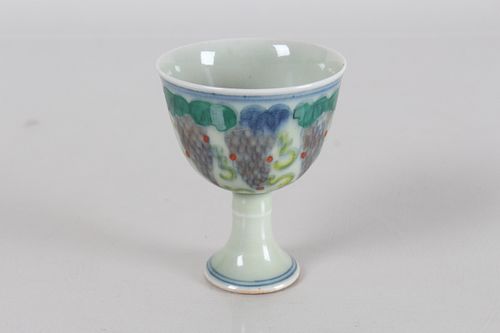 Appraisal: A CHINESE GRAPE-FORTUNE PORCELAIN FORTUNE CUPA Chinese Grape-fortune Porcelain Fortune