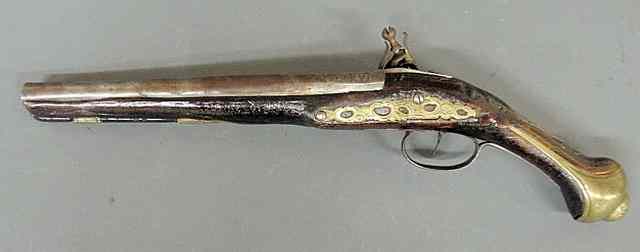 Appraisal: Continental th c flintlock pistol with engraved brass and silver